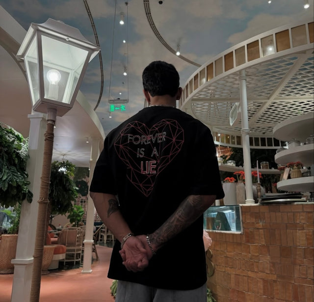 back photo of model wearing unisex forever is a lie tee from outdrip