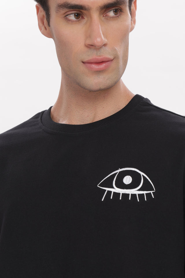 Cosmic Watcher Tee lifestyle photo – Outdrip premium streetwear India
