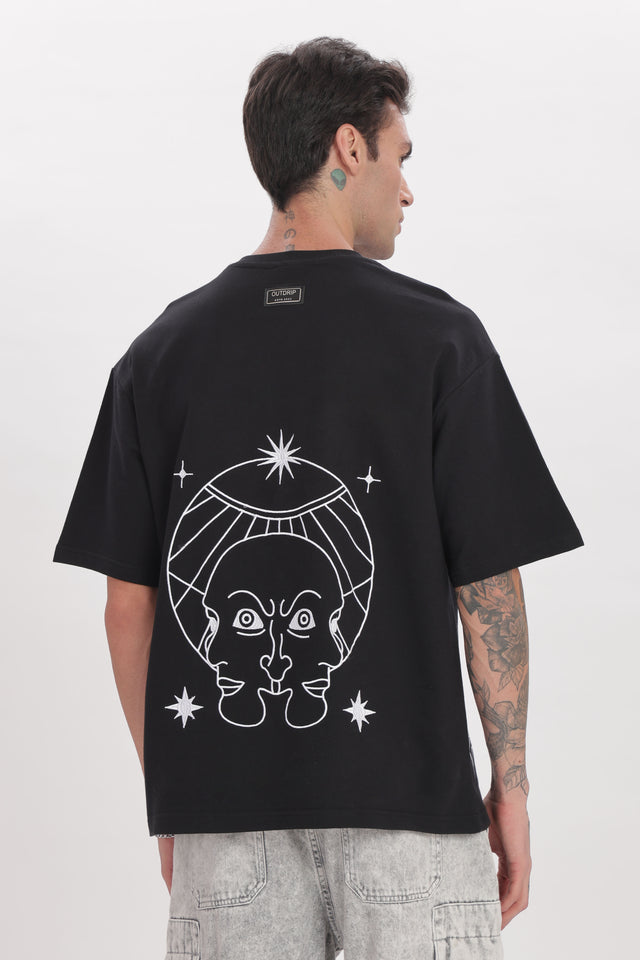 back photo of model wearing unisex cosmic watcher tee from outdrip 