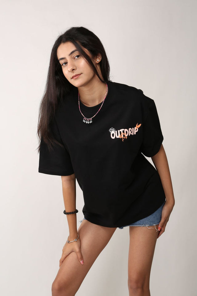 Female model in DARE2DRIP T-shirt – oversized fit featuring bold puff print and screen-printed design