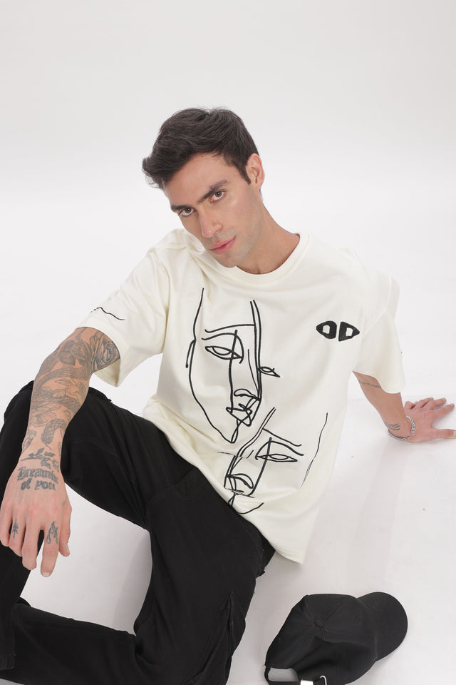 male model wearing unisex fragmented faces tee from outdrip