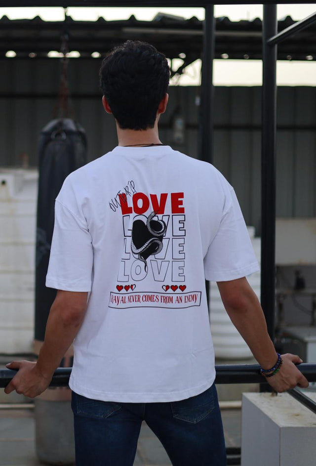 Male model wearing Outdrip’s white Love tee, styled for everyday streetwear with a bold statement piece.
