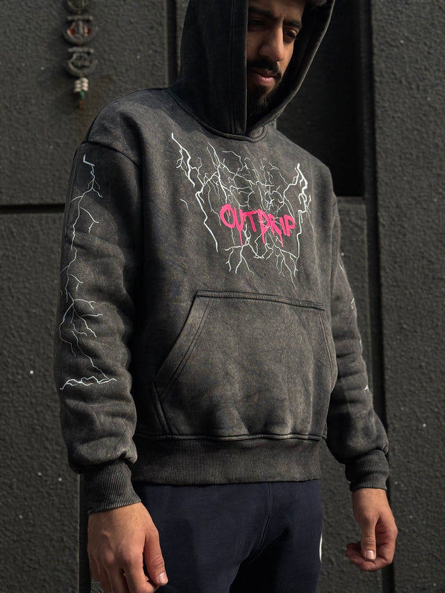 Male model wearing OD THUNDER HOODIE – oversized streetwear hoodie with front DTF print on acid-washed heavyweight fabric
