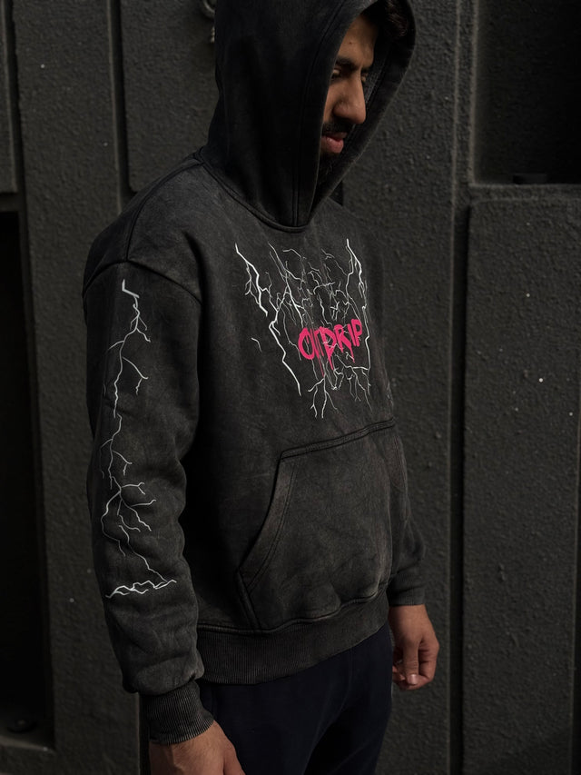 Male model wearing OD THUNDER HOODIE – oversized streetwear hoodie with front DTF print on acid-washed heavyweight fabric
